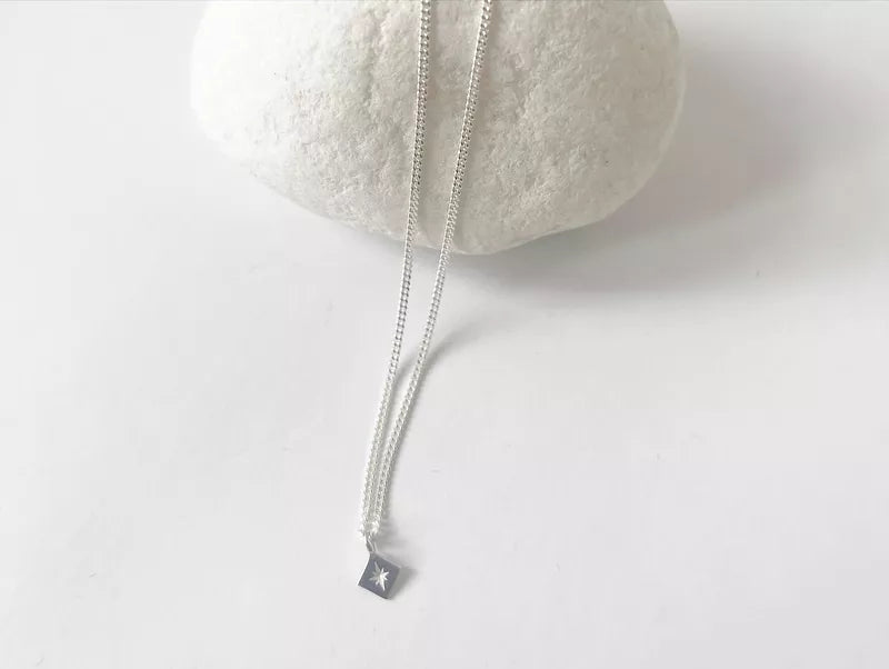 NECKLACE WITH TINY COMPASS PENDANT